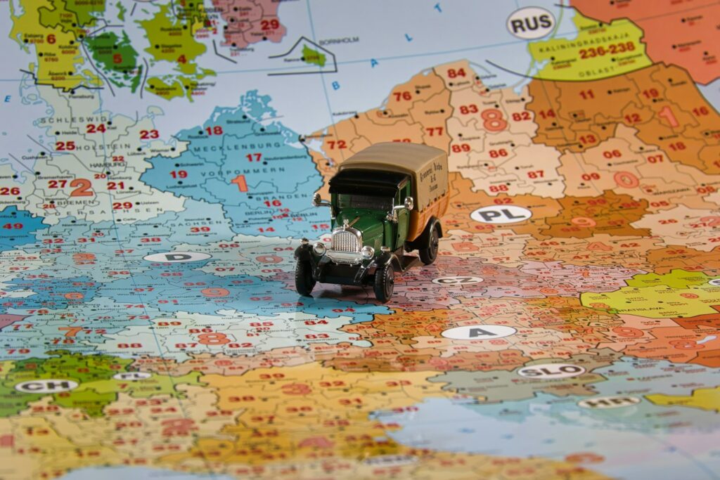A toy truck travels across europe on a map.