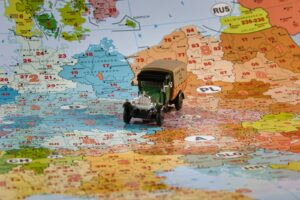 A toy truck travels across europe on a map.
